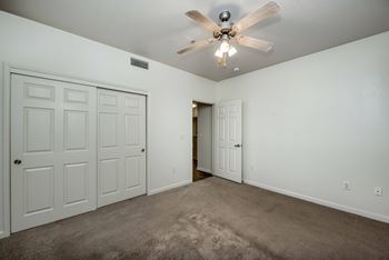 Large Bedroom - Ceiling Fan - Sliding door closet - Carpeted floors